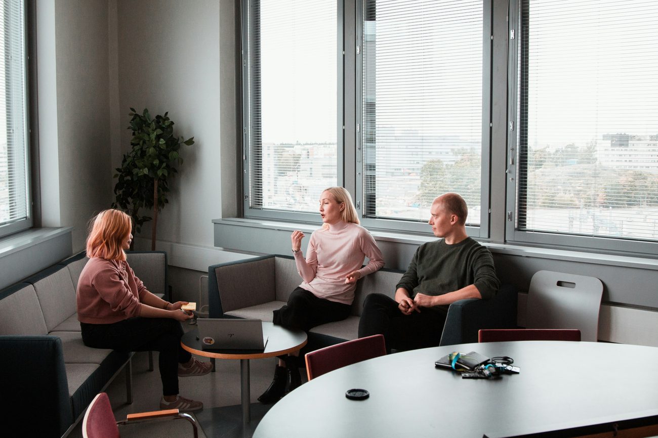 A hiring conversation between colleagues in a bright office